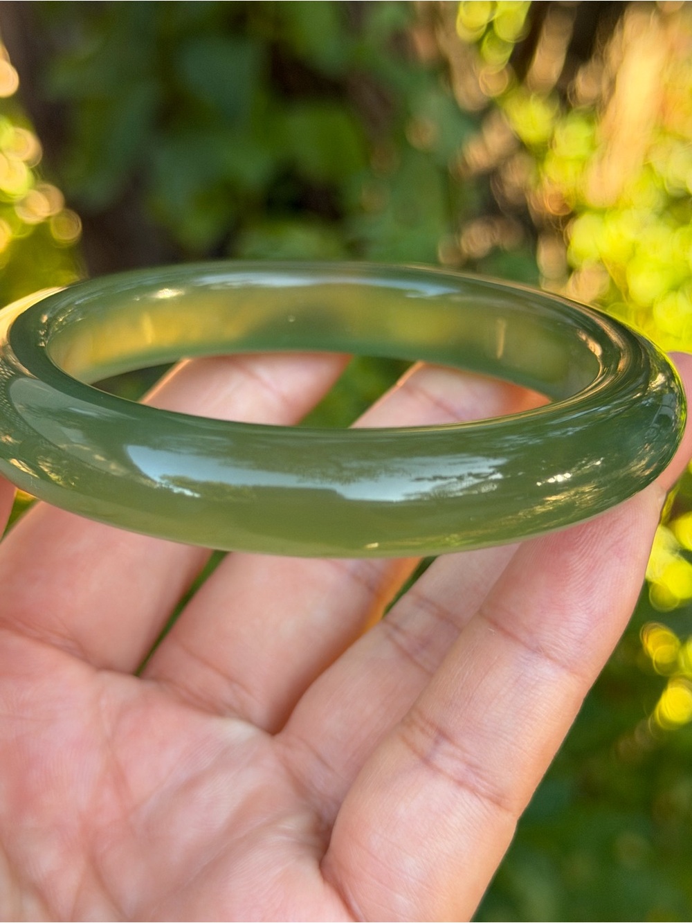 58mm Inner Diameter Olive Green Translucent Xiuyu Jade Bangle 1985